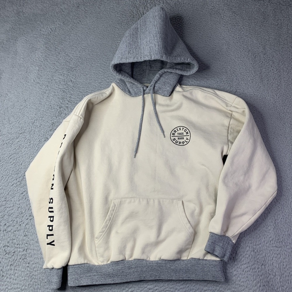 Brixton Men's Crest Hoodie featuring a circular logo on the chest  Beige & Grey